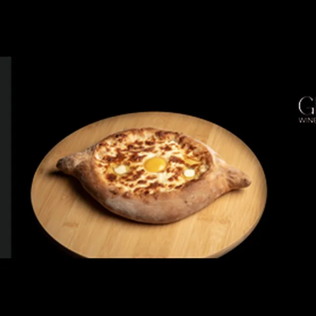 Adjaruli khachapuri boat with cheese, butter and egg