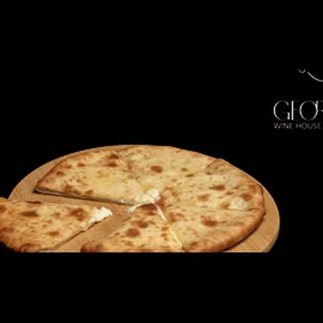Round Imeruli khachapuri cheese bread cut into wedges